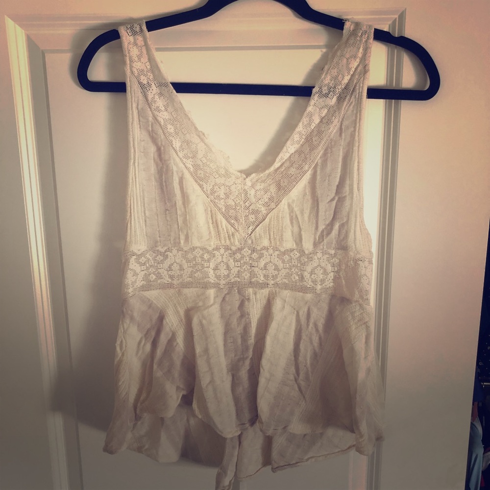 Lacy tank with detail. Fits like a S/M